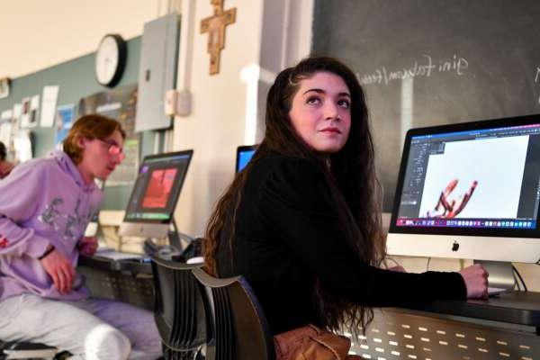 students working on computers for graphic design